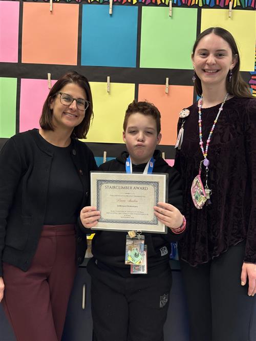 Liam Austin, Jefferson's Stairclimber for November, poses with his award plaque.